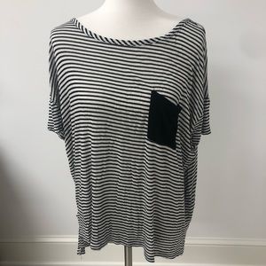 A black and white striped shirt with a back pocket